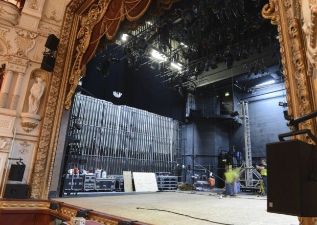 A photo of the stage inside the Lycaem theatre with the lights on