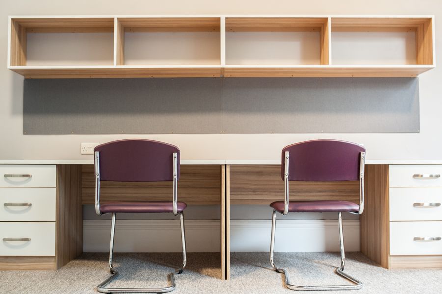 A photo of two desks side by side