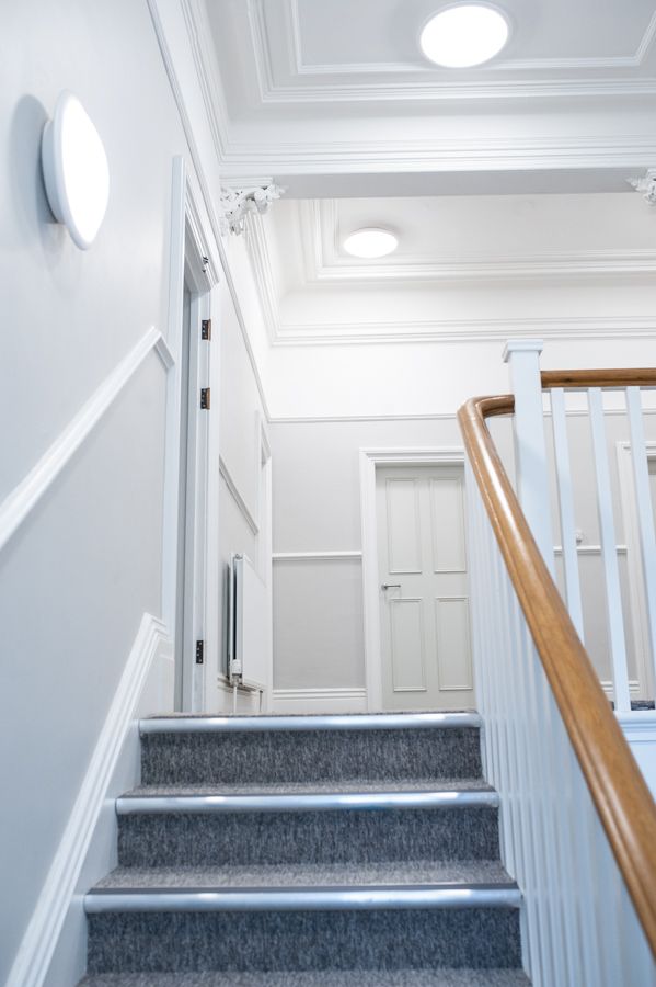 A photo looking up the stairs to the hallway