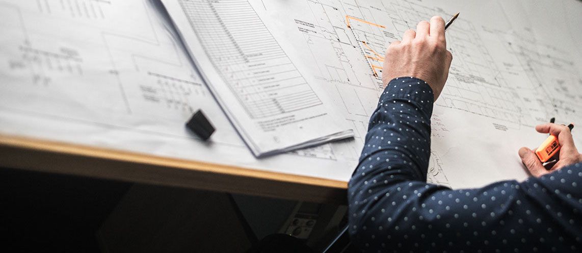 A man working on blueprints